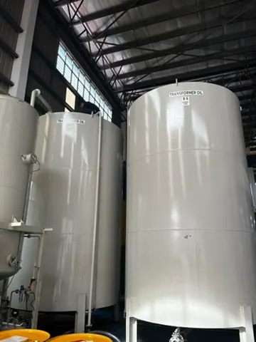 Transformer-oil storage tanks inside an industrial building